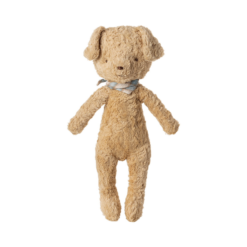 A plush light brown dog toy with floppy ears, wearing a brown collar, stands upright against a white background.