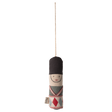 Cloth toy soldier ornament with a black hat, embroidered face, and patterned uniform hangs from a string against a white background.