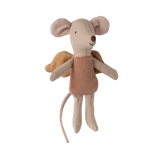 A soft, beige toy mouse with large ears and angelic wings, wearing a brown shirt. The mouse appears joyful, emanating a playful, whimsical vibe.