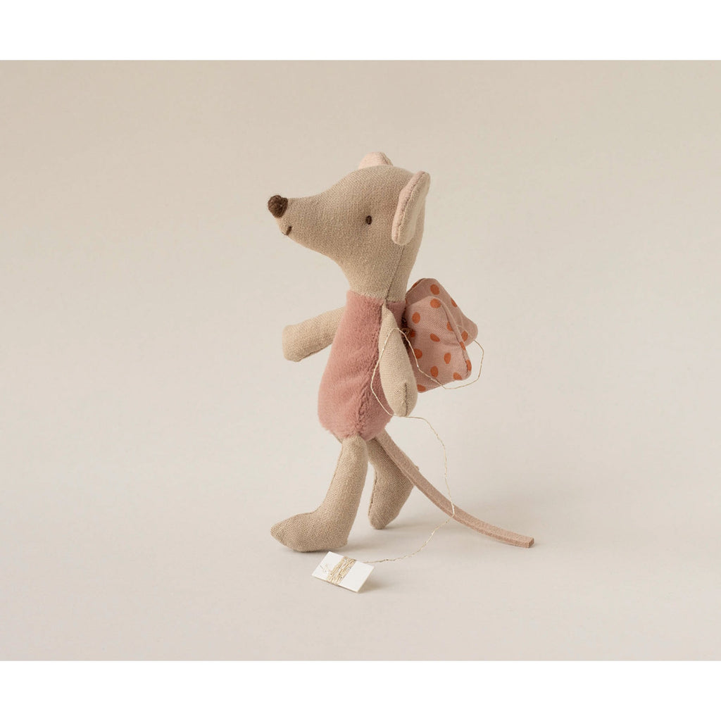 A cute plush toy mouse with large ears and a friendly smile, wearing a pink outfit and polka dot wings, giving an impression of whimsy and playfulness.