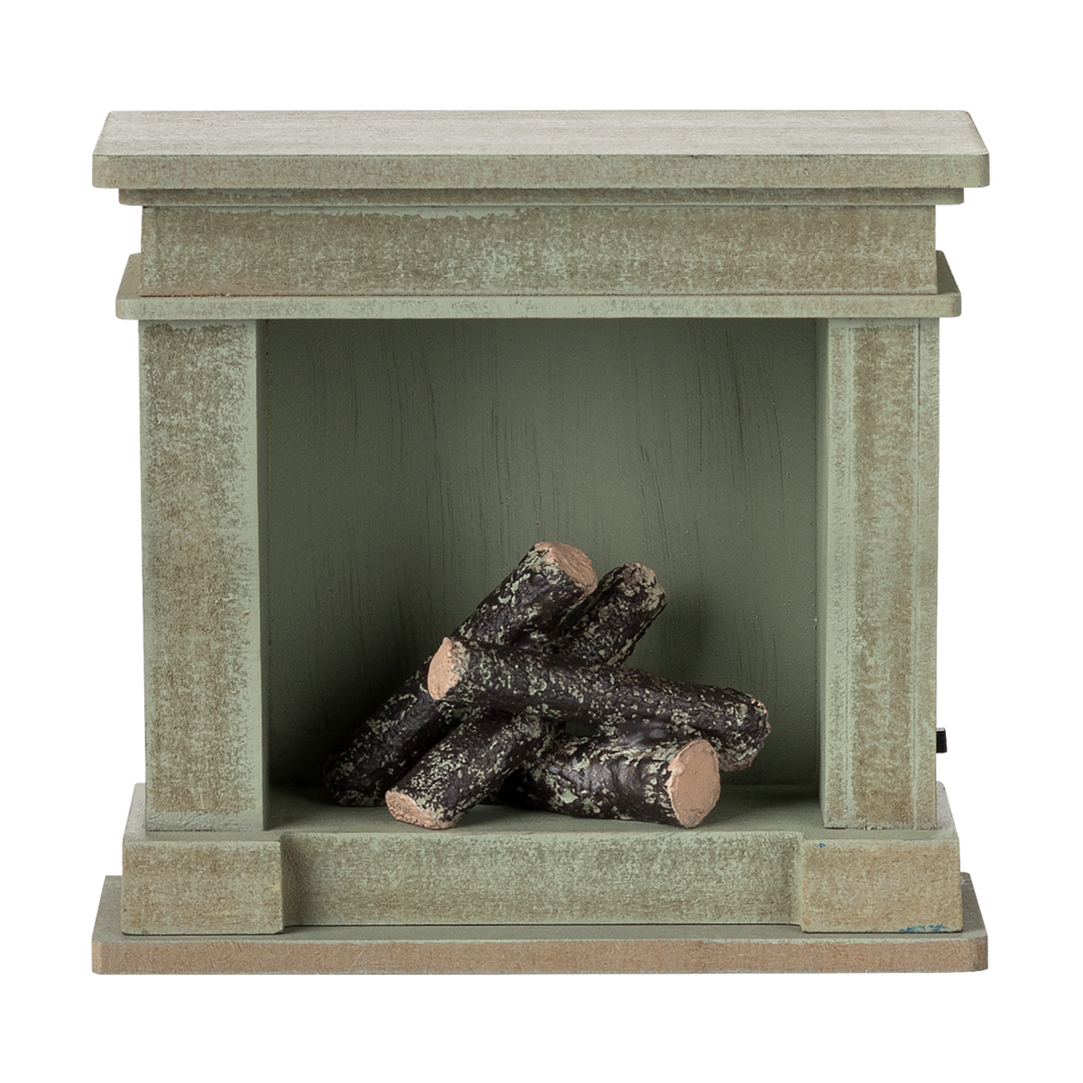 A decorative miniature fireplace with a greenish-gray finish, holding several stacked logs inside, showcasing a cozy and rustic vibe.