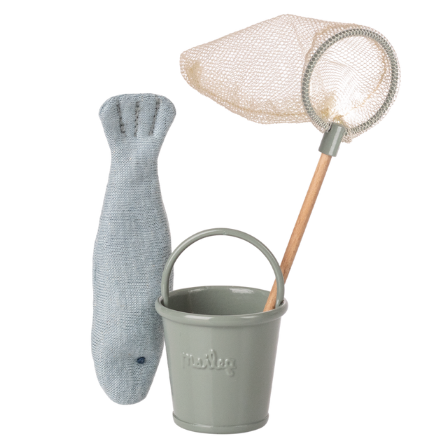 Toy fishing set on a white background featuring a gray knit fish, light gray metal bucket, and a wooden-handled net with a cream mesh.