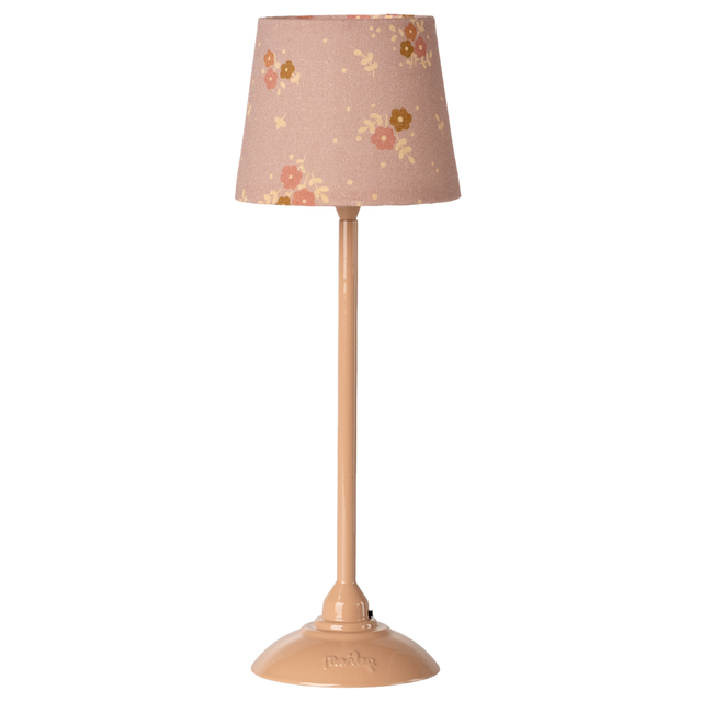 Beige lamp with a floral-patterned shade featuring pink and yellow flowers, set against a white background. The tone is cozy and vintage.