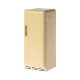 A toy refrigerator in a pale yellow color, is shown with its door slightly ajar. The fridge has a retro design with rounded edges, a silver-colored handle on the right side of the door, and the word "MAILEG" embossed vertically on the door. Inside, three shelves with ribbed textures are visible.