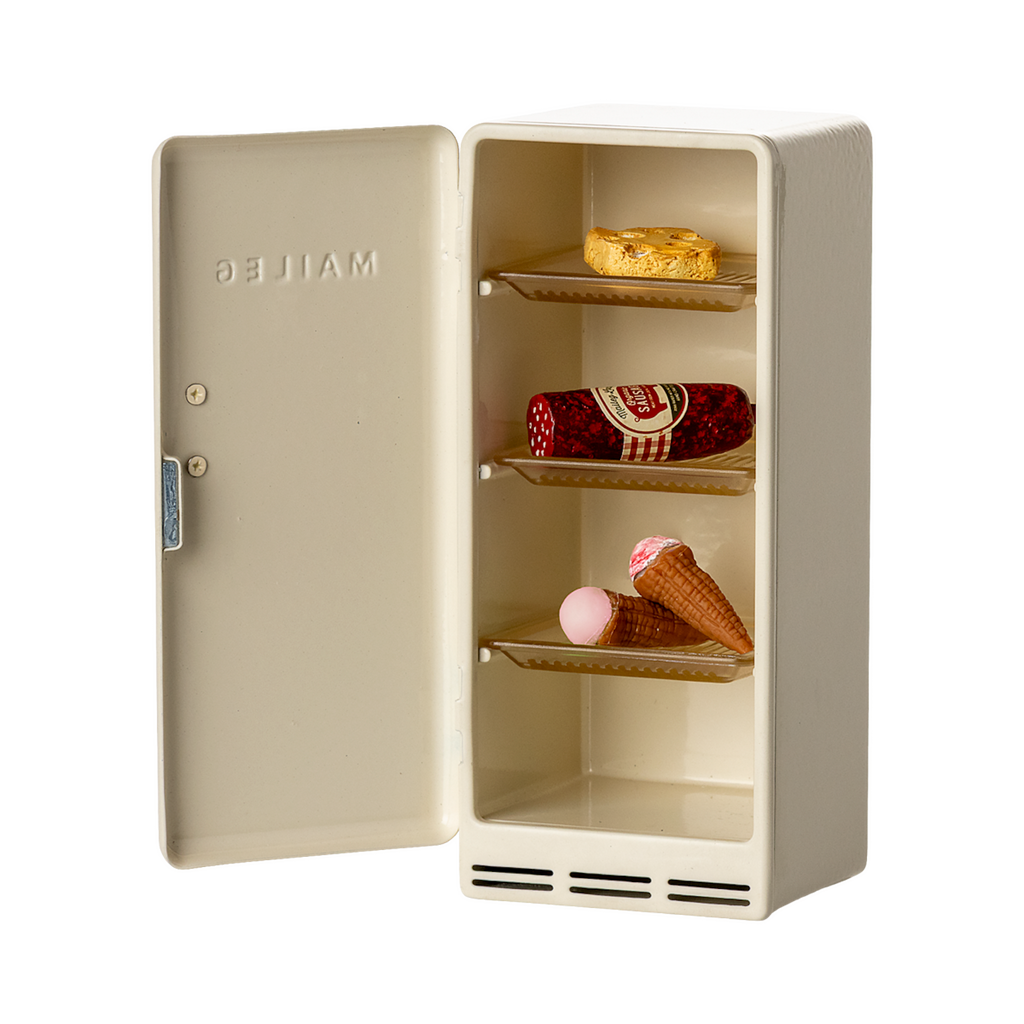 Open cream-colored miniature fridge showing toy food: a cookie, sausage, and two ice cream cones. Playful and whimsical tone.