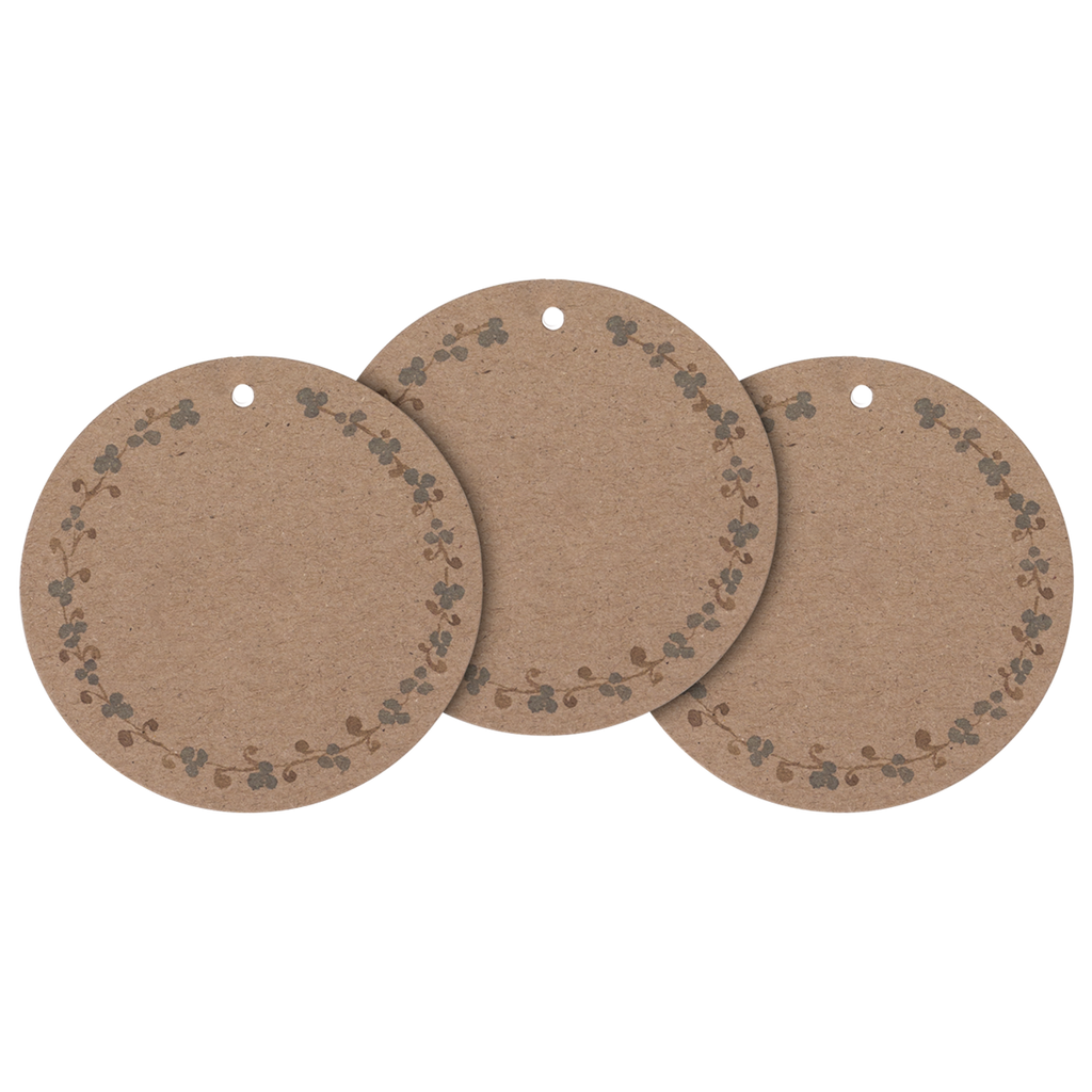 Three round, brown paper tags with floral borders and a hole for hanging, set against a white background, conveying a rustic, natural feel.