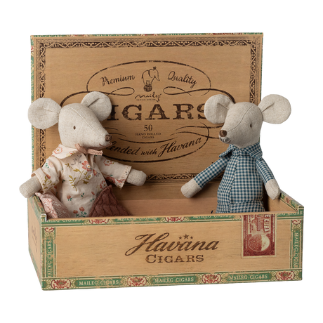 Two fabric mice in vintage clothes sit inside an open wooden cigar box labeled "Havana Cigars." The scene is playful and nostalgic.