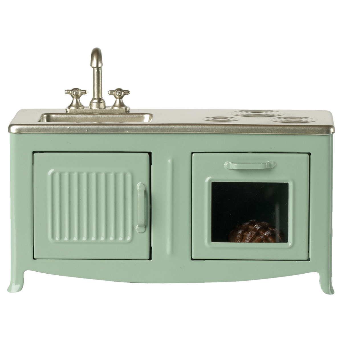 A miniature vintage kitchen set in pale green with a silver faucet and stove. It includes a sink, oven with a glass door, and a visible brown pie inside.