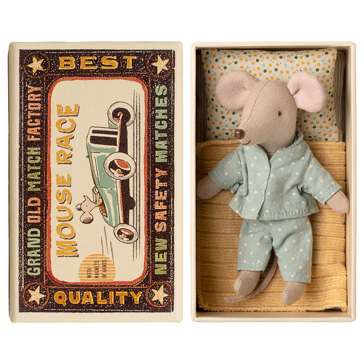 Toy mouse in blue pajamas lies in a matchbox, resembling a cozy bed. The box has vintage-style "Mouse Race" label. Cute and nostalgic.
