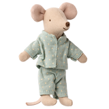 A cute, plush toy mouse stands against a white background, wearing light blue pajamas with white polka dots. The mouse's expression is gentle and charming.