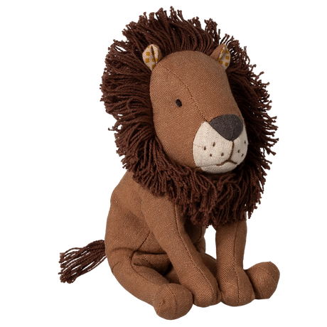 A plush lion toy with a soft, brown mane and a friendly expression, sits against a white background. Its textured fabric body enhances the cuddly appeal.