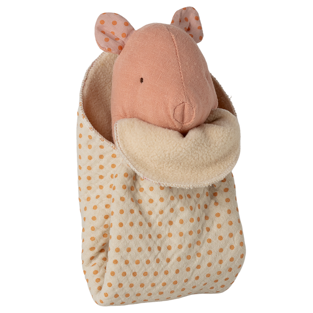 A soft pink fabric mouse peeks out of a cozy, polka-dotted sleeping bag with an orange and cream color scheme on a white background.