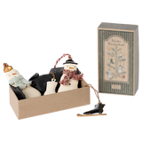 A festive set of snowman ornaments in a box with a vintage design, accompanied by a decorative gift box labeled "Winter Wonderland."