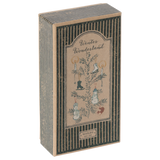 Vintage-style cardboard box titled "Winter Wonderland," decorated with winter motifs like ice skates, candles, snowmen, and pine branches, creating a nostalgic feel.