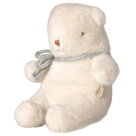 Maileg mini teddy bear plush toy in off-white sitting in a side profile view with a ribbon bow.
