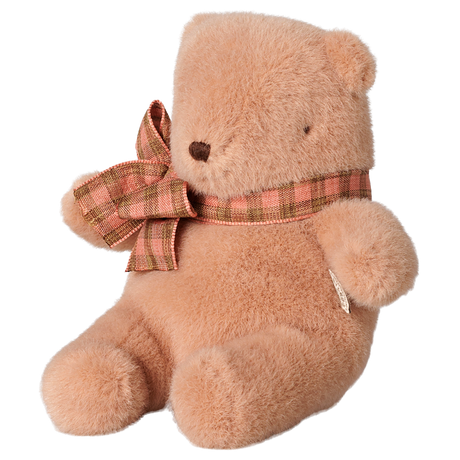 Maileg mini teddy bear plush in vintage rose with a plaid bow tie, sitting profile view.