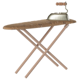 A vintage-style toy ironing board with a patterned, brown cover, and a small metal toy iron with a wooden handle sits on top. The background is white.