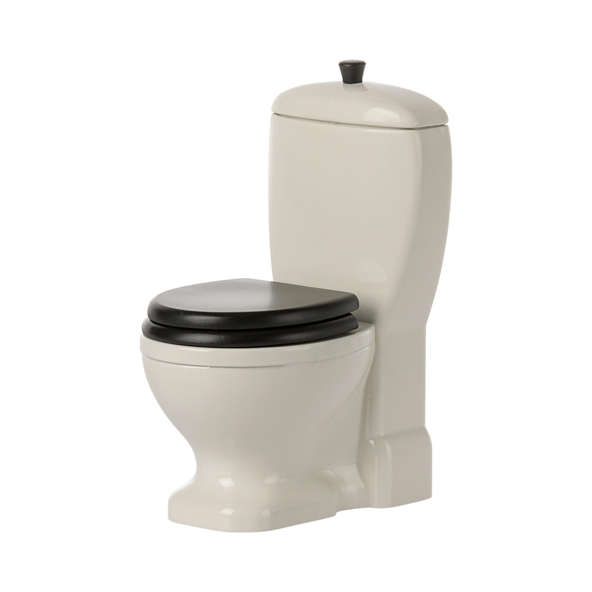 A detailed white dollhouse toilet with realistic features and movable lid—perfect for Maileg mice, bunnies, and dollhouse bathroom setups to inspire imaginative play.