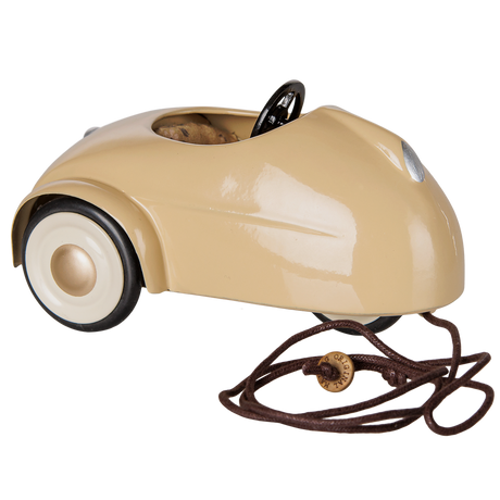 Maileg metal mouse car in wheat color with a brown pull string.