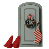 Maileg mouse Christmas door set with miniature green door, wreath, striped stocking, and red hats.
