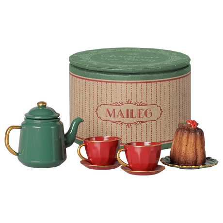 Maileg miniature mouse Christmas tea party toy set with green teapot, red teacups, and cake.