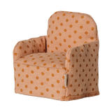Maileg dollhouse miniature folding chair for mice with a peach and orange polka dot fabric pattern.