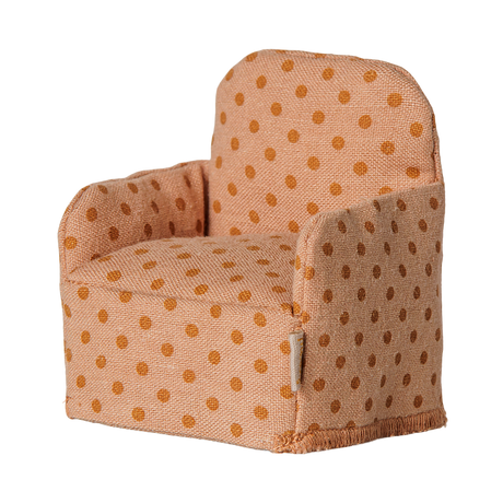 Maileg dollhouse miniature folding chair for mice with a peach and orange polka dot fabric pattern.