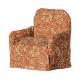 Maileg miniature dollhouse armchair with a pink floral pattern fabric.