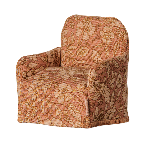 Maileg miniature dollhouse armchair with a pink floral pattern fabric.