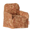 Maileg miniature dollhouse armchair in a pink floral pattern fabric.