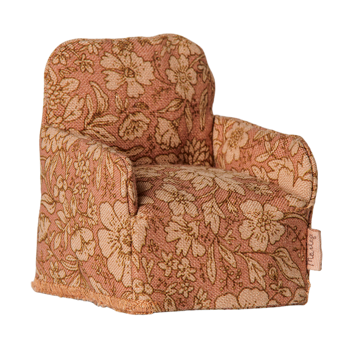 Maileg miniature dollhouse armchair in a pink floral pattern fabric.