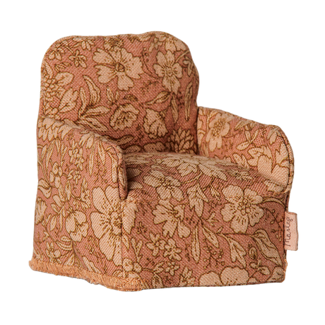 Maileg miniature dollhouse armchair in a pink floral pattern fabric.