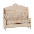 Maileg miniature kitchen bench in light sand with floral pattern cushions.