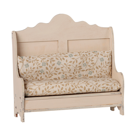 Maileg miniature kitchen bench in light sand with floral pattern cushions.