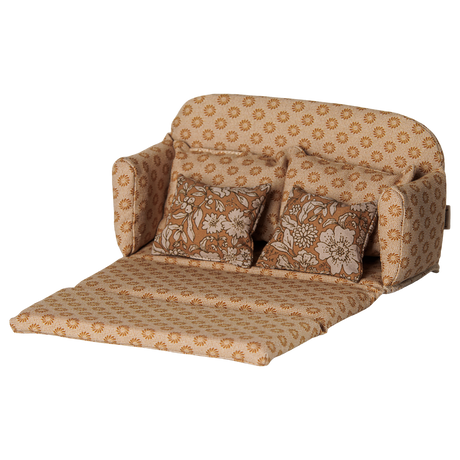 Maileg mouse dollhouse large sofa bed in ocher, unfolded open with floral pillows.