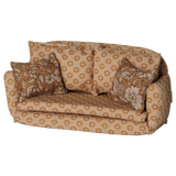 Maileg miniature large ocher sofa bed with floral pillows, designed for dollhouse furniture decor.