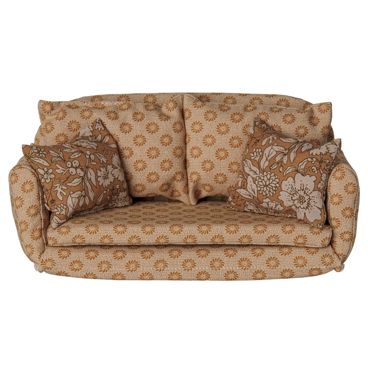 Maileg miniature dollhouse sofa bed in ocher with floral patterned pillows.