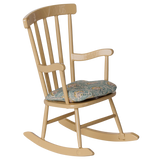 Maileg miniature wooden rocking chair in wheat color with a patterned floral seat cushion.