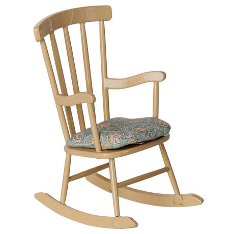 Maileg miniature wooden rocking chair in wheat color with a patterned floral seat cushion.