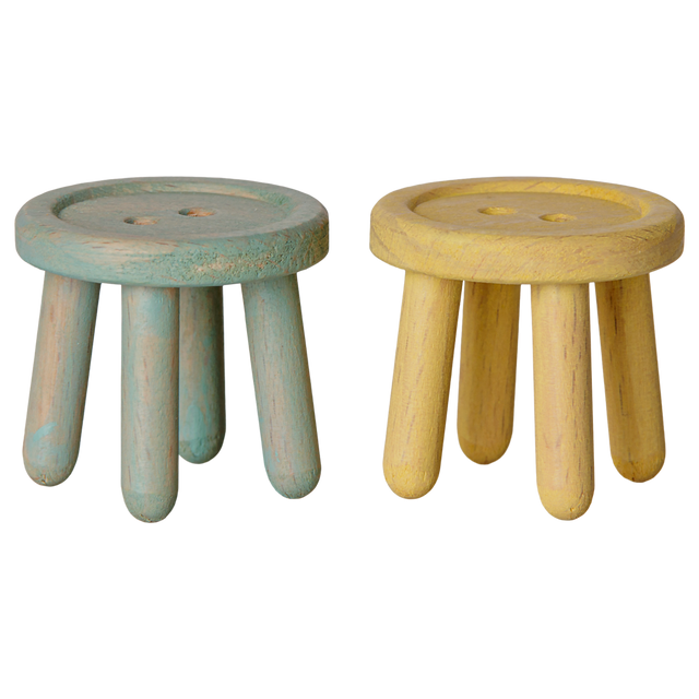 Maileg mouse dollhouse stool set featuring two small wooden button-shaped stools in mint and light yellow.
