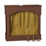 Maileg miniature mouse theater with a yellow checkered curtain and metal stands.