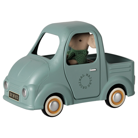 Maileg mouse toy truck in mint green with a plush mouse driver, vintage metal vehicle.
