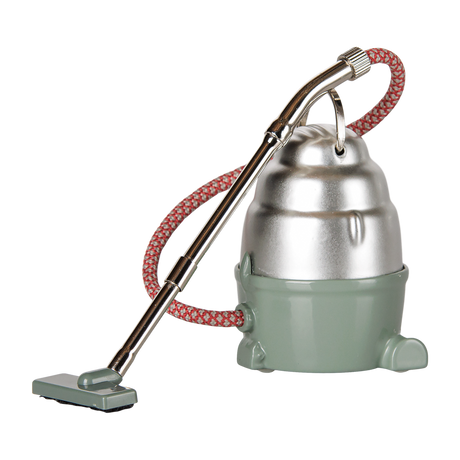 Maileg dollhouse mouse vacuum cleaner in dark mint green and silver with a red patterned hose.