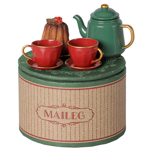 Maileg Christmas tea party set with a green teapot, red teacups, and a bundt cake on a decorative box.