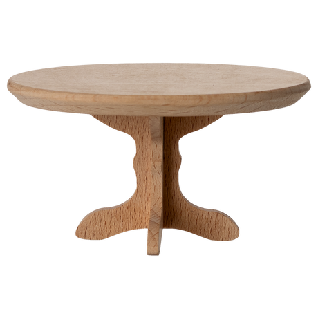 A miniature, oval wooden table with a smooth top and a decorative, carved pedestal base, showcasing a natural wood finish.