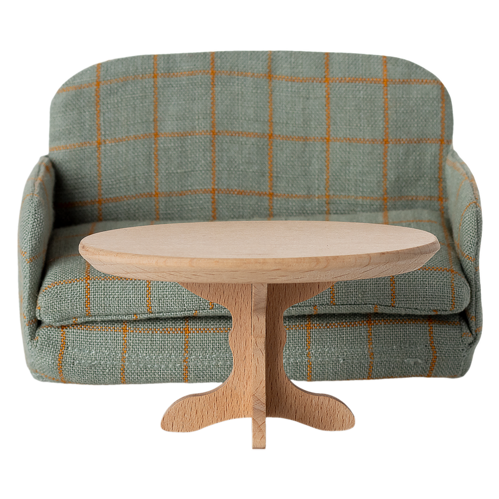 A miniature, oval wooden table with a smooth top and a decorative, carved pedestal base, showcasing a natural wood finish.