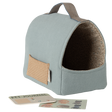 Light blue fabric pet carrier with a brown patterned interior and a small external pocket. A pet journal and stickers lie in front, all set against a white background.