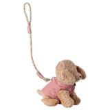 Plush dog keychain wearing a pink quilted jacket, attached to a floral-patterned strap. Set against a white background, conveying a cute, stylish vibe.