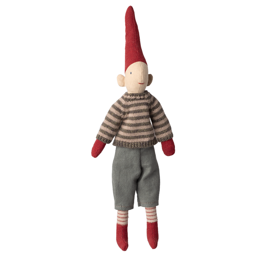 A whimsical fabric elf doll with a tall red hat, striped sweater, gray pants, and red mittens stands against a white background, exuding a playful charm.