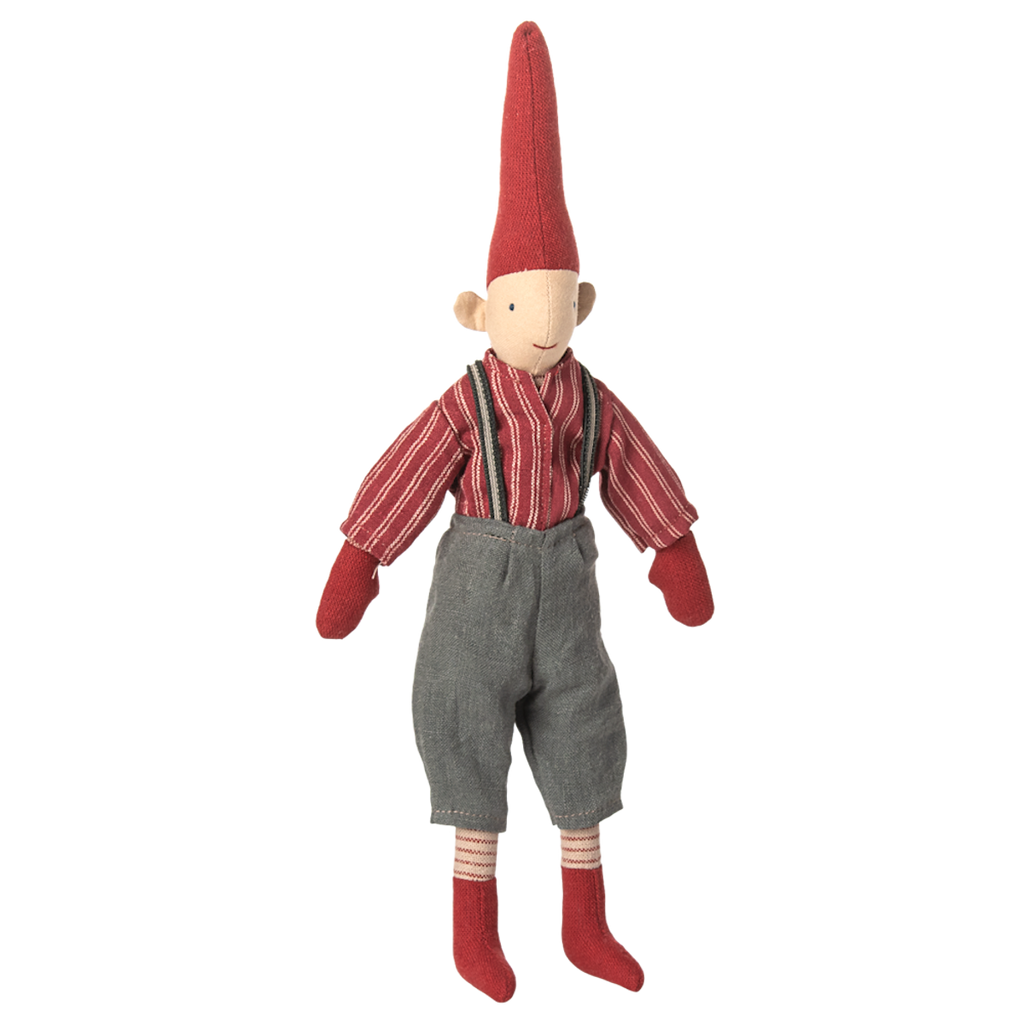 Cloth doll with a tall red hat, red striped shirt, gray overalls, and red socks on a white background. The doll has a simple, cheerful design.